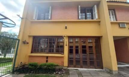 Casa em condomínio fechado com 4 quartos à venda na Rua General Gomes Carneiro, 80, Medianeira, Porto Alegre por R$ 477.000