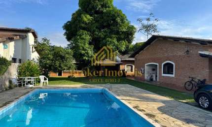 CASA TÉRREA COM 4 DORMITÓRIOS E PISCINA, 100M DA PRAIA NO JARDIM BRITÂNIA