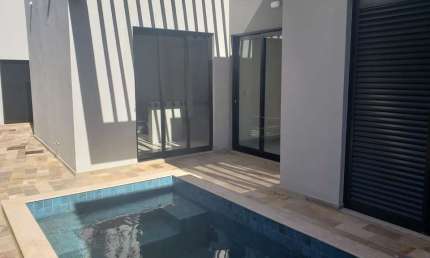 Casa em condomínio fechado com 3 quartos à venda no Grand Ville, Uberlândia  por R$ 1.260.000
