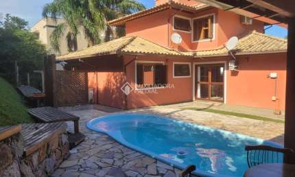 Casa em condomínio fechado com 4 quartos à venda na Rodovia Doutor Antônio Luiz Moura Gonzaga, 383, Rio Tavares, Florianópolis, 200 m2 por R$ 2.950.000