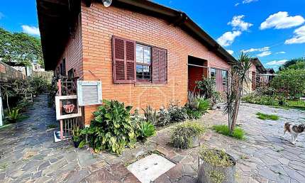Casa com 3 quartos à venda na Rua Flávio Barros, 111, Bom Sucesso, Gravataí, 150 m2 por R$ 450.000