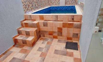 Casa em condomínio com 2 dormitórios e piscina à venda, por R$ 315.000 - Cibratel II - Itanhaém/SP