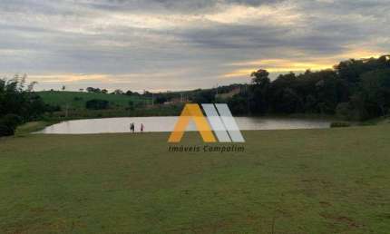 Lindo lote num condomínio onde tem muita natureza .