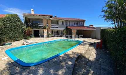 Casa com 4 quartos à venda na Rua Paná Paná, 892, Atlântida, Xangri-Lá por R$ 948.000