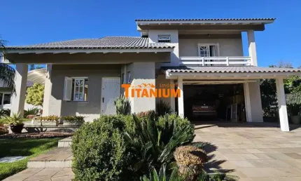 Casa à venda com 4 dormitórios, piscina, área gourmet, maravilhoso jardim no Bairro Ideal em Novo Hamburgo.