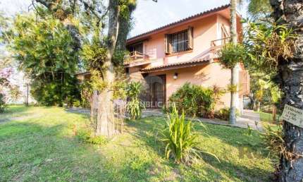 Casa com 4 quartos à venda na Rua Itapitocaí, 725, Cristal, Porto Alegre