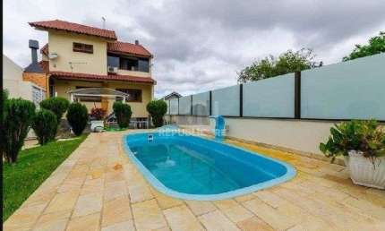 Casa com 3 quartos à venda na Rua Zeferino Dias, 390, Sarandi, Porto Alegre