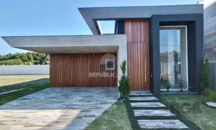 Casa térrea, com 225M², 04 suítes, sendo uma suíte americana, lavabo, living int