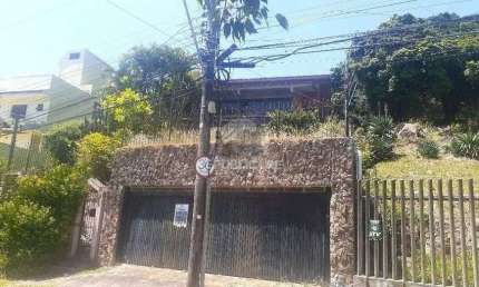 Casa com 5 quartos à venda na Rua Alcebíades Antônio dos Santos, 260, Nonoai, Porto Alegre