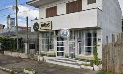 Apartamento de frente com 1 dormitório, sala, cozinha e sacada.