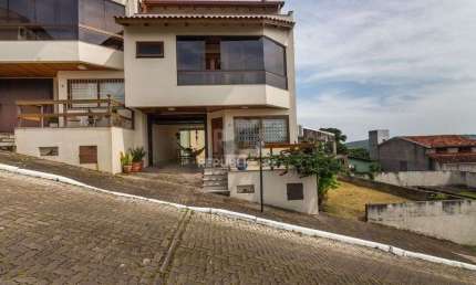 Casa em condomínio fechado com 3 quartos à venda na Rua Alcebíades Antônio dos Santos, 635, Nonoai, Porto Alegre