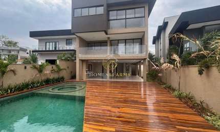 ESPETACULAR CASA TRIPLEX A VENDA, COM FUNDO PARA A MATA NO CONDOMÍNIO DO LAGO