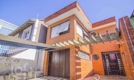 Casa com 4 quartos à venda na Rua Eudoro Berlink, 482, Auxiliadora, Porto Alegre, 214 m2 por R$ 1.500.000