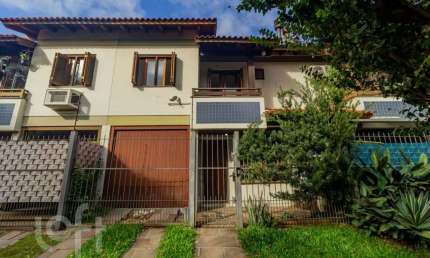 Casa em condomínio fechado com 3 quartos à venda na Rua Itapitocaí, 1031, Cristal, Porto Alegre, 105 m2 por R$ 430.000