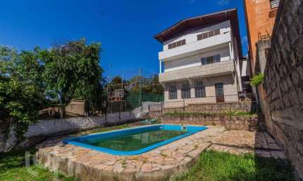 Casa com 4 quartos à venda na Praça São Caetano, 84, Teresópolis, Porto Alegre, 432 m2 por R$ 1.590.000