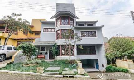 Casa em condomínio fechado com 3 quartos à venda na Rua Tocantins, 869, Agronomia, Porto Alegre, 385 m2 por R$ 1.700.000