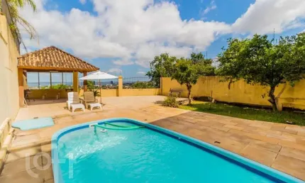 Casa com 4 quartos à venda na rua alcebíades antônio dos santos, 379, nonoai, porto alegre, 375 m2 por r$ 1.805.000