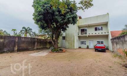 Casa com 3 quartos à venda na Rua Jerolomo Minuzo, 464, Vila Nova, Porto Alegre, 331 m2 por R$ 799.000