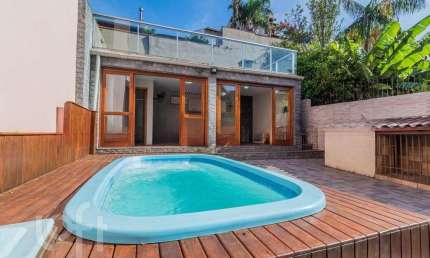 Casa em condomínio fechado com 3 quartos à venda na Rua Erechim, 100, Nonoai, Porto Alegre, 220 m2 por R$ 700.000