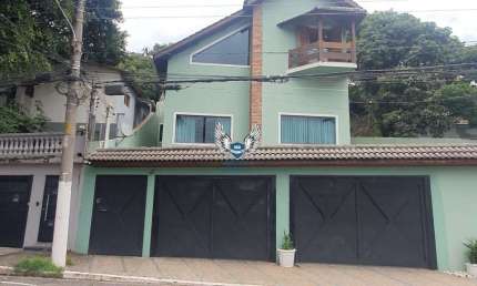 SOBRADO 04 QUARTOS SENDO 03 SUITES , 05 VAGAS DE GARAGEM E PISCINA