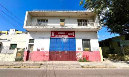 Prédio com loja comercial e 2 apartamentos a venda em Santa Maria/RS