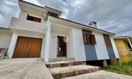Ampla casa no Novo Horizonte com 3 dormitórios e 2 vagas de garagem!