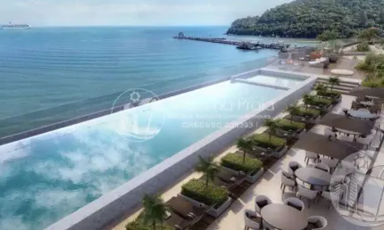 Apartamento frente mar no edifício pharos com 4 suítes e 3 a