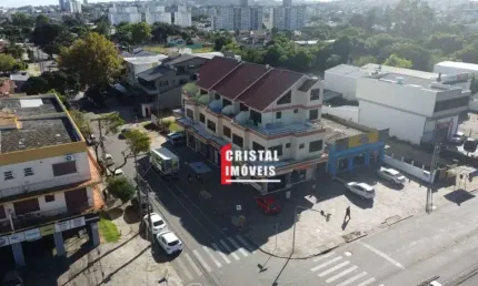 Prédio comercial com 7 lojas e 13 salas comerciais a venda no Bairro Camaquã - AV21756