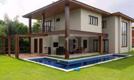 CASA A VENDA EM PRAIA DO FORTE, LITORAL NORTE DA BAHIA - Condomínio Praia Bella, acesso direto à praia, 5 suítes de alto padrão com móveis inclusos.
