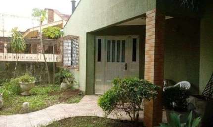 Terreno com casa no bairro Santa Fé em Porto Alegre