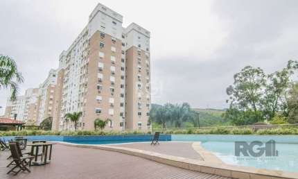Apartamento de três dormitórios, suíte e uma vaga de garagem no bairro Jardim Carvalho em Porto Alegre.