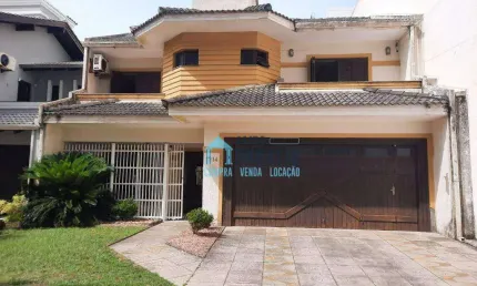 Sobrado com 4 dormitórios(sendo 2 suítes) à venda por R$ 960.000 - Centro - Tramandaí/RS