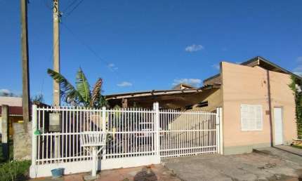 Casa principal + 2 casas para locação no mesmo terreno, à venda por R$ 140.000 - Centro - Balneário Pinhal/RS