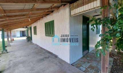Terreno com 2 casas, uma em alvenaria e uma em madeira, à venda por R$ 110.000 - Balneario Pinhal - Balneário Pinhal/RS