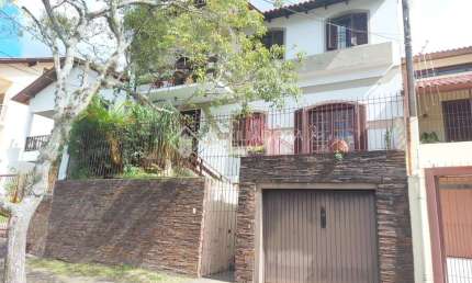 Casa em condomínio fechado com 4 quartos à venda na Rua Nero José da Silva Filho, 205, Partenon, Porto Alegre, 260 m2 por R$ 650.000