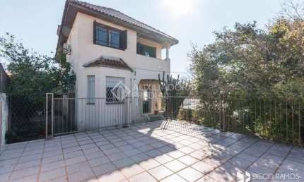 Casa em condomínio fechado com 4 quartos à venda na Rua Tobias Barreto, 369, Partenon, Porto Alegre, 190 m2 por R$ 585.000