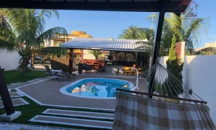 Casa com 3 dormitórios à venda por R$ 970.000 - Barra do Jacuípe - Camaçari/BA