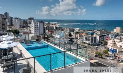 Apartamento semi-mobiliado na pituba, 1 quarto, 1 sala, 1 banheiro e cozinha com cooktop, 1 vaga de garagem.