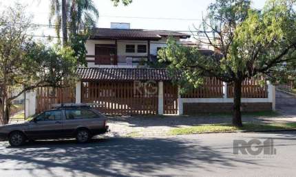 Casa com 4 quartos à venda na Rua Upamaroti, 794, Cristal, Porto Alegre