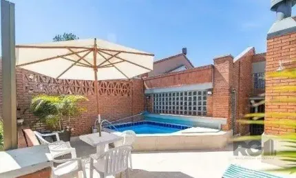 Casa em condomínio fechado com 3 quartos à venda na Avenida Jacuí, 978, Cristal, Porto Alegre