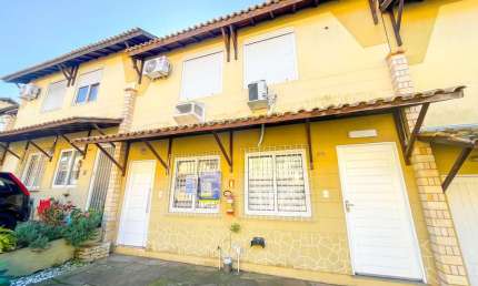 Casa de dois quartos, uma vaga de garagem, em condomínio fechado em Porto Alegre