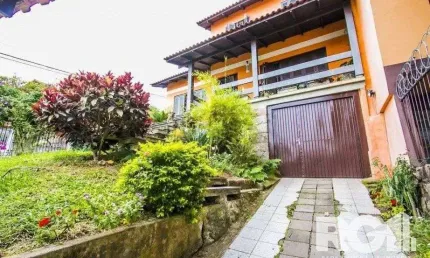 Casa com 5 quartos à venda na Rua Ângelo Passuelo, 79, Vila Nova, Porto Alegre