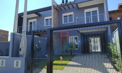 Sobrado com 3 dormitórios à venda, 112 m² por R$ 630.000,00 - Girassol - Gravataí/RS
