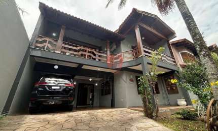Sobrado com 4 dormitórios à venda, 320 m² por R$ 1.170.000 - Girassol - Gravataí/RS