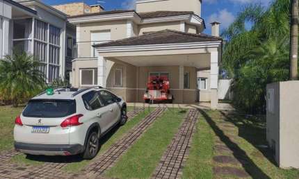 Casa com 3 dormitórios, 220 m² - venda por R$ 2.200.000,00 ou aluguel por R$ 10.178,52 - Alphaville - Gravataí/RS