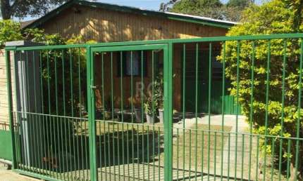 Casa com 3 quartos à venda na Rua Paulo Rubilar de Farias, 142, Restinga, Porto Alegre