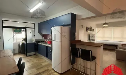 Apartamento mobiliado para locação na Mooca de 51m² com cozinha planejada, sala 2 ambientes, dormitório, banheiro social e área de serviço.