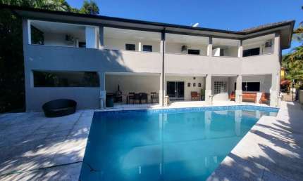 Luxuosa casa em condomínio à venda em Bertioga-SP, Guaratuba: 4 quartos, 4 suítes, 3 salas, 4 vagas e 450m²!