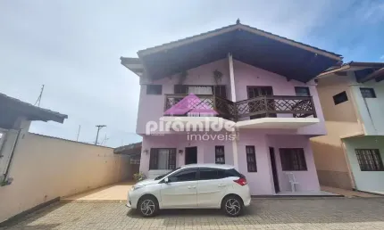 Casa com 3 dormitórios à venda, 103 m² por R$ 650.000,00 - Massaguaçu - Caraguatatuba/SP