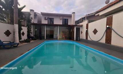 Incrível sobrado com piscina no bairro Canadá - SO641